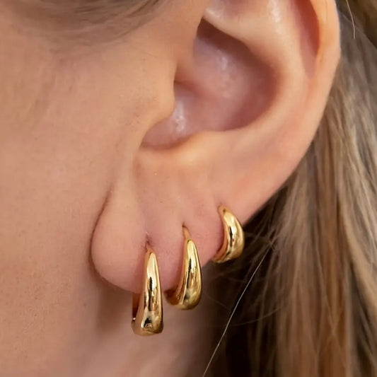 Golden closed earrings